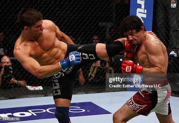 Josh Thomson kicks Gilbert Melendez during the Strikeforce event at HP Pavilion on May 19, 2012 in San Jose, California.