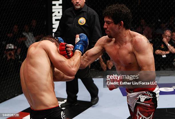 Gilbert Melendez punches Josh Thomson during the Strikeforce event at HP Pavilion on May 19, 2012 in San Jose, California.