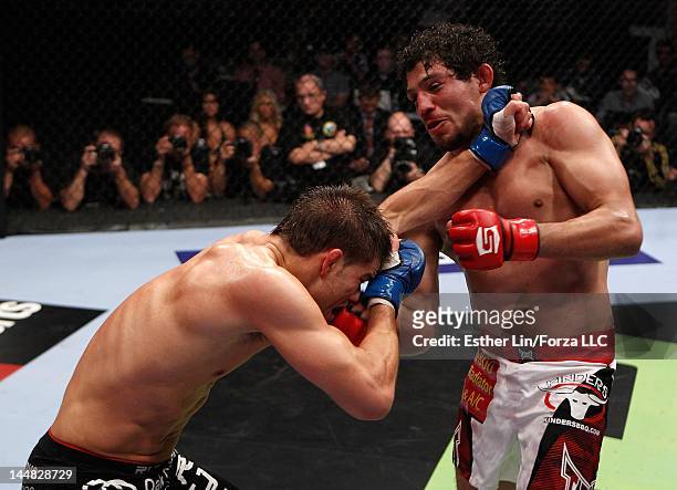 Gilbert Melendez punches Josh Thomson during the Strikeforce event at HP Pavilion on May 19, 2012 in San Jose, California.