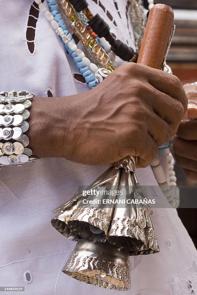 Man holding agogo bells in hand