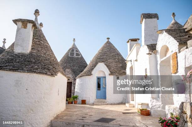 traditional apulian trulli houses. apulia, italy - conical roof stock pictures, royalty-free photos & images