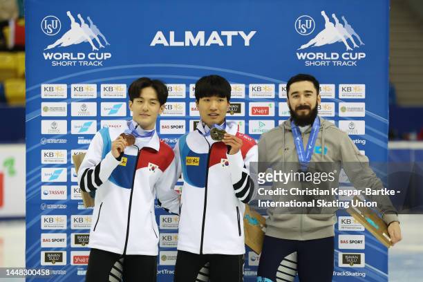Sungwoo Jang of Korea, Taesung Lee of Korea and Denis Nikisha of Kazakhstan pose on podium after medal ceremony of Men's 500m Final A race during the...