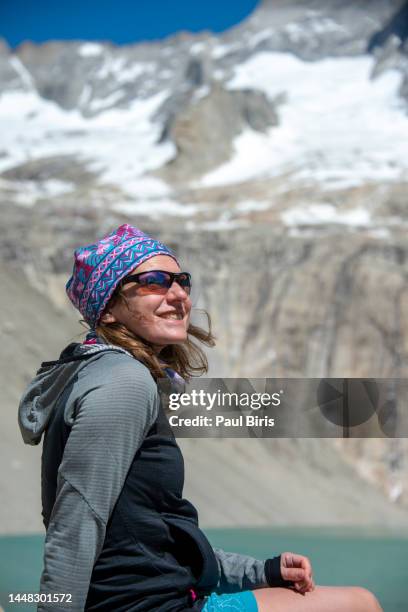 hiker at mirador base las torres in torres del paine national park, patagonia, chile, south america - w stock-fotos und bilder