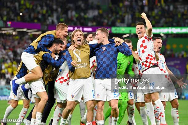 Croatia players celebrate their victory through the penalty shootout in the FIFA World Cup Qatar 2022 quarter final match between Croatia and Brazil...