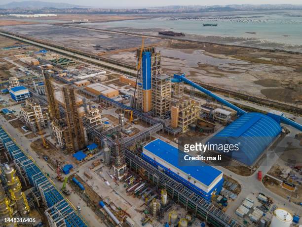 aerial view of the chemical plant under construction at the seaside - oil sands stock pictures, royalty-free photos & images