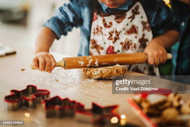 child making christmas cookies. - pastry cutter bildbanksfoton och bilder