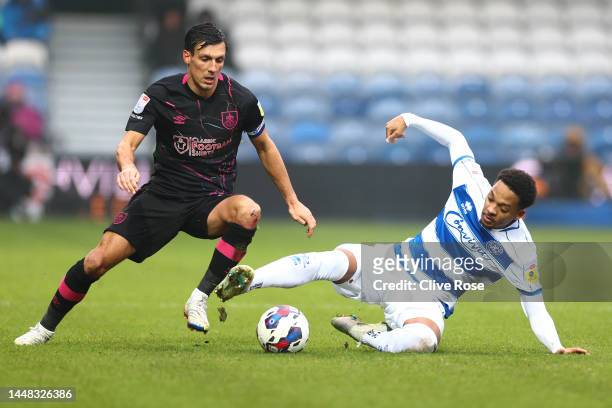 Chris Willock of Queens Park Rangers is tackled by Jack Cork of Burnley during the Sky Bet Championship between Queens Park Rangers and Burnley at...