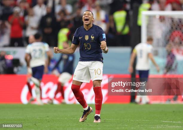 Kylian Mbappe of France celebrates after Harry Kane of England misses a penalty during the FIFA World Cup Qatar 2022 quarter final match between...