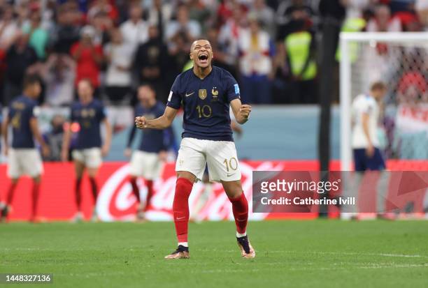 Kylian Mbappe of France celebrates after Harry Kane of England misses a penalty during the FIFA World Cup Qatar 2022 quarter final match between...