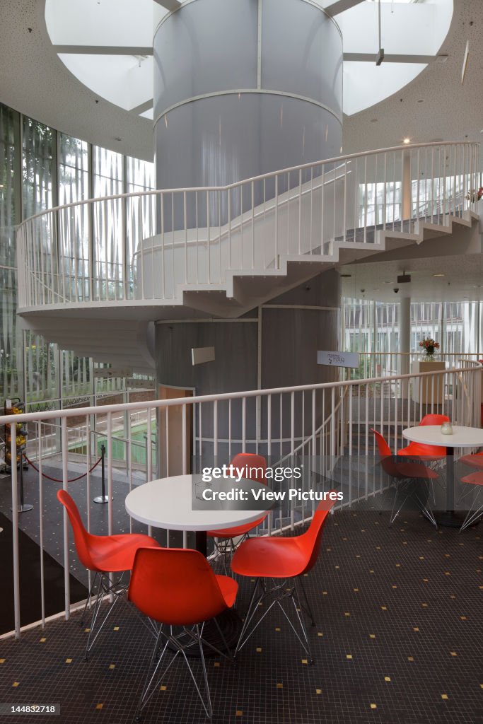 Tivoli Concert Hall, Vesterbrogade, Copenhagen, Region Hovedstaden, Denmark Architect:  3Xn 2005 Tivoli Concert Hall  3Xn  Copenhagen Denmark  2005  Interior Of Rotunden With Cafe Tables And Chairs And Spiral Staircase