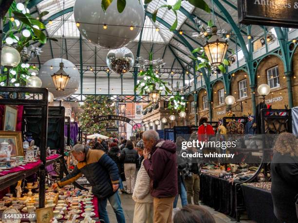 antique stalls at christmas in covent garden, london - christmas shopping stock pictures, royalty-free photos & images