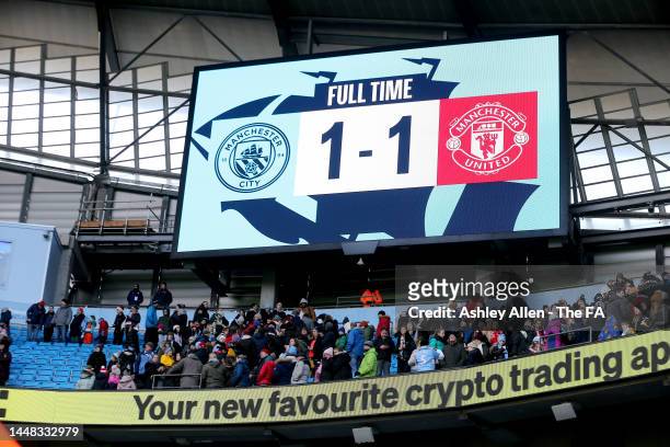 Full time score is displayed on the giant screen during the FA Women's Super League match between Manchester City and Manchester United at Etihad...