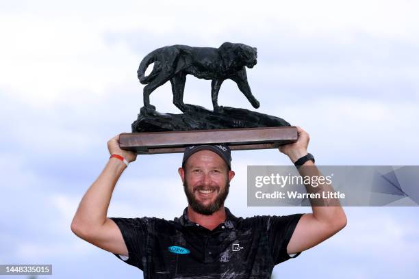 Ockie Strydom of South Africa lifts the Alfred Dunhill Championship trophy after winning the Championship during Day Four of the Alfred Dunhill...