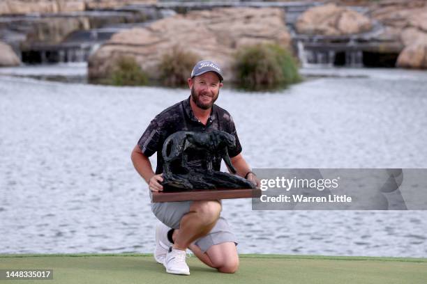 Ockie Strydom of South Africa lifts the Alfred Dunhill Championship trophy after winning the Championship during Day Four of the Alfred Dunhill...