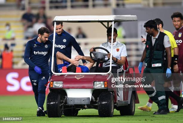 Armando Broja of Chelsea leaves the field on a stretcher after receiving medical treatment during the Al Wahda Challenge Cup match between Chelsea...