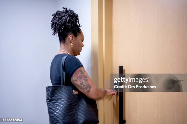 woman using electronic card to open the door - door close button imagens e fotografias de stock