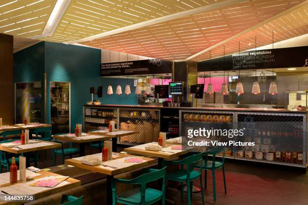 Wahaca, Canada Square, London, E14, United Kingdom, Architect: Softroom Wahaca Restaurant, Softroom, London Overall View Of Restaurant With Tables...