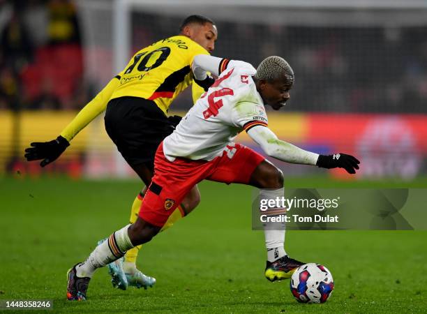 Joao Pedro of Watford and Jean Michael Seri of Hull City in action during the Sky Bet Championship between Watford and Hull City at Vicarage Road on...