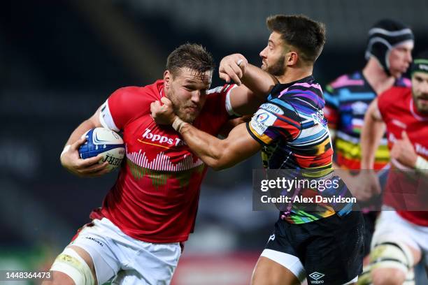 Hanro Liebenberg of Leicester Tigers is challenged by Rhys Webb of Ospreys during the Heineken Champions Cup Pool B match between Ospreys and...