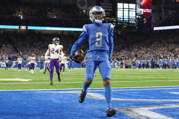 Jameson Williams of the Detroit Lions celebrates a touchdown during the first quarter of the game against the Minnesota Vikings at Ford Field on...