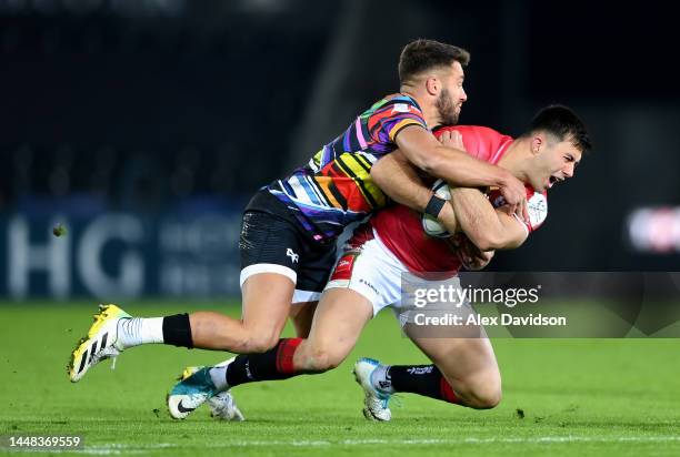 Dan Kelly of Leicester Tigers is tackled by Rhys Webb of Ospreys during the Heineken Champions Cup Pool B match between Ospreys and Leicester Tigers...