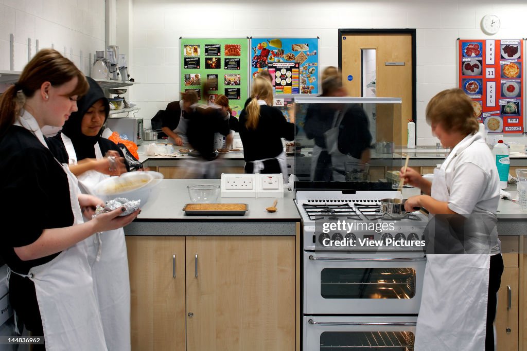 Brislington Enterprise CollegeBristol, Avon, United Kingdom Architect:  Flacq Architects 2008 Brislington Enterprise College, Flacq Architects Bristol, 2008 An Interior Shot Showing Students During A Cookery Class In A Modern Classroom