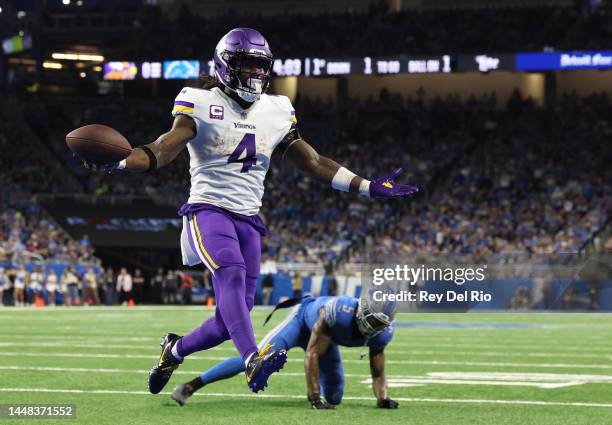 Dalvin Cook of the Minnesota Vikings celebrates after a touchdown during the first quarter of the game against the Detroit Lions at Ford Field on...