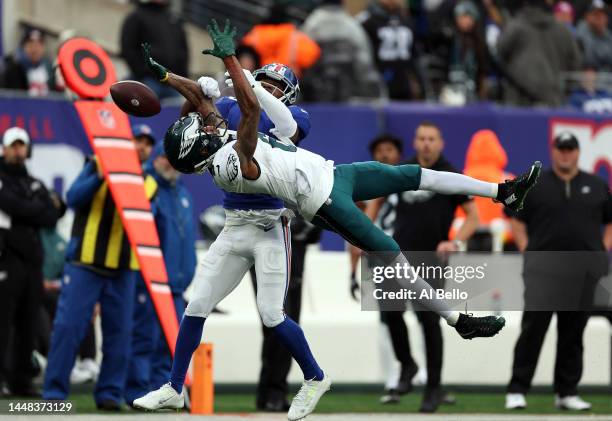 Darnay Holmes of the New York Giants breaks up a pass intended for DeVonta Smith of the Philadelphia Eagles during the second quarter of the game at...