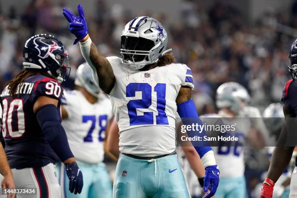 Ezekiel Elliott of the Dallas Cowboys reacts to a first down in the first half of a game against the Houston Texans at AT&T Stadium on December 11,...