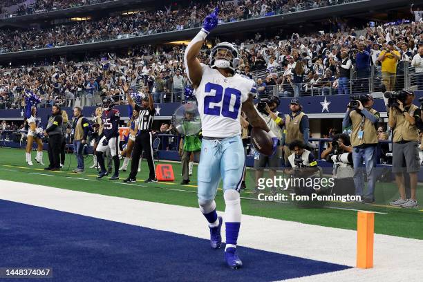 Tony Pollard of the Dallas Cowboys scores a touchdown in the second quarter of a game against the Houston Texans at AT&T Stadium on December 11, 2022...