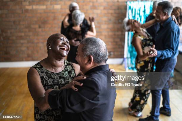 amputee mature man dancing with his wife in dance hall - dance floor stock pictures, royalty-free photos & images