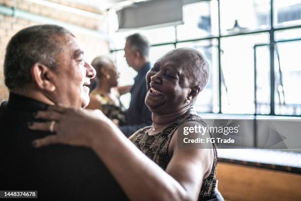 senior couple dancing waltz in dance hall - swing dance stock pictures, royalty-free photos & images