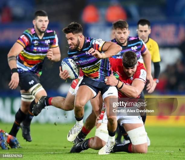 Rhys Webb of Ospreys is tackled by Eli Snyman of Leicester Tigers during the Heineken Champions Cup Pool B match between Ospreys and Leicester Tigers...