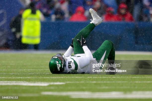 Quinnen Williams of the New York Jets lies on the field in the second quarter of a game against the Buffalo Bills at Highmark Stadium on December 11,...