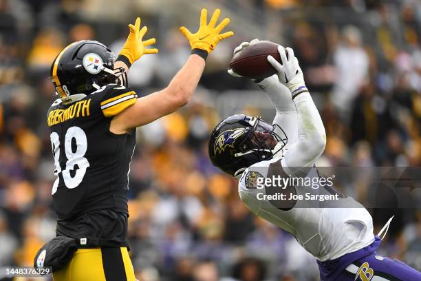 Patrick Queen of the Baltimore Ravens intercepts the pass intended for Pat Freiermuth of the Pittsburgh Steelers in the second quarter of the game at...