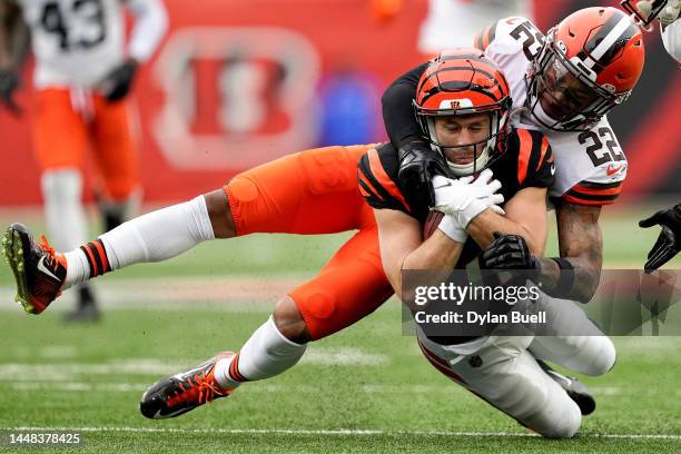 Trent Taylor of the Cincinnati Bengals gets tackled by Grant Delpit of the Cleveland Browns in the second quarter at Paycor Stadium on December 11,...