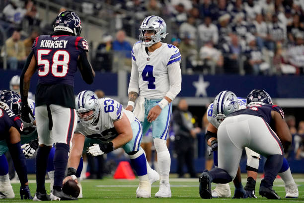 Dak Prescott of the Dallas Cowboys looks during the first half of a game against the Houston Texans at AT&T Stadium on December 11, 2022 in...