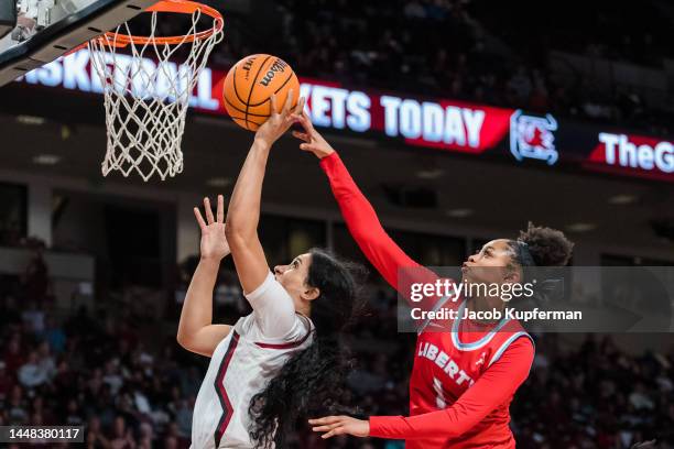 Kennedi Williams of the Liberty Lady Flames tries to block a shot from Brea Beal of the South Carolina Gamecocks in the second quarter during their...