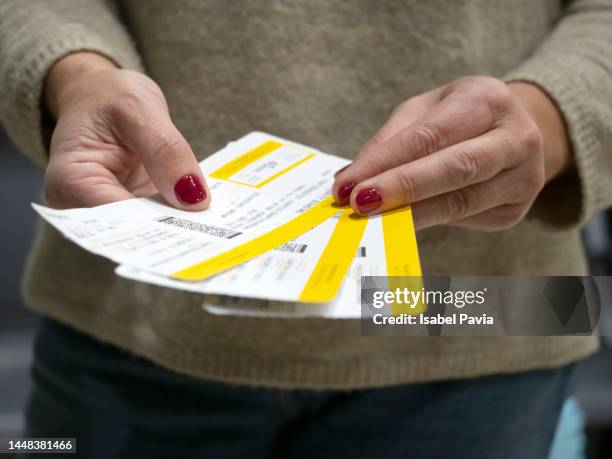 female hands holding boarding passes - paris airport stock pictures, royalty-free photos & images