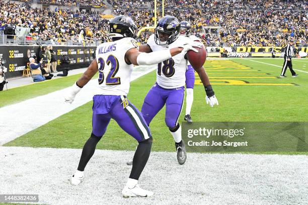 Marcus Williams and Roquan Smith of the Baltimore Ravens celebrate after an interception in the third quarter of the game at Acrisure Stadium on...