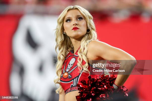 Cheerleader of the Tampa Bay Buccaneers watches the game against the New Orleans Saints at Raymond James Stadium on December 5, 2022 in Tampa,...