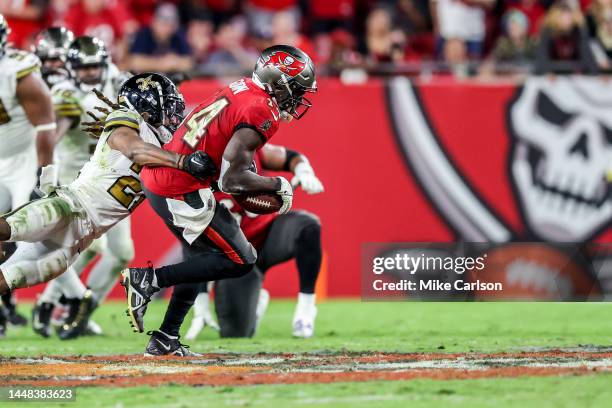 Chris Godwin of the Tampa Bay Buccaneers makes a catch against Bradley Roby of the New Orleans Saints at Raymond James Stadium on December 5, 2022 in...