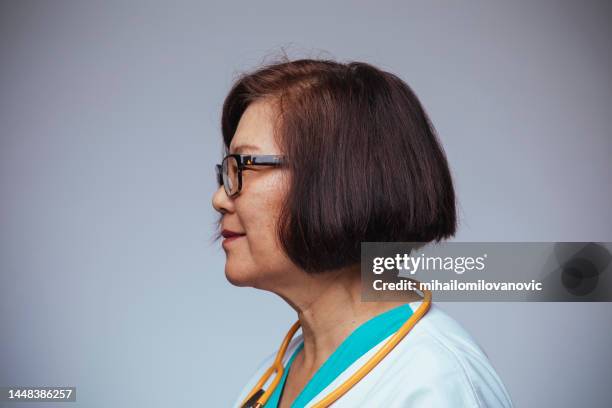 close-up profile portrait - doctor side view stock pictures, royalty-free photos & images