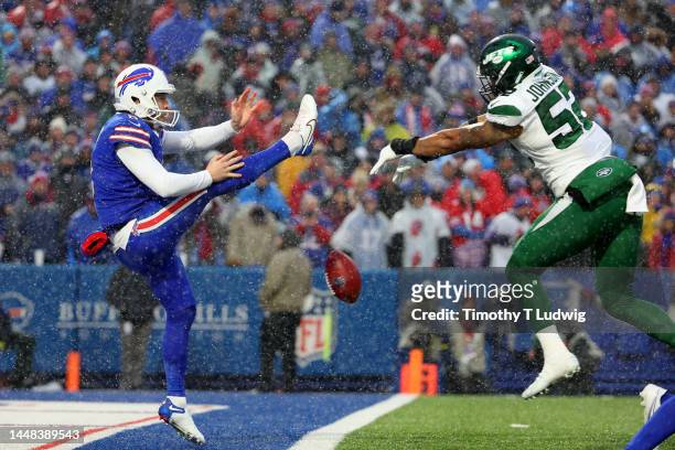 Jermaine Johnson of the New York Jets blocks a punt from Sam Martin of the Buffalo Bills in the fourth quarter at Highmark Stadium on December 11,...