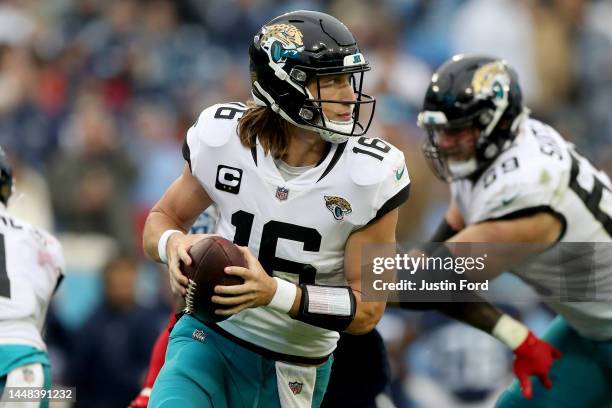 Trevor Lawrence of the Jacksonville Jaguars holds the ball during a play during the game against the Tennessee Titans at Nissan Stadium on December...