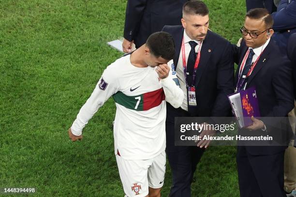 Cristiano Ronaldo of Portugal walks off the pitch after the team's defeat during the FIFA World Cup Qatar 2022 quarter final match between Morocco...