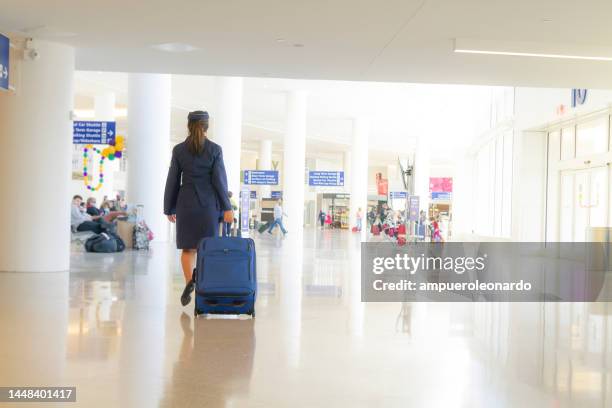 portrait of beautiful latin flight attendant staff leaving from the airport terminal. feeling welcome all customer or passenger to the airplane. travel concept. - air stewardess stock pictures, royalty-free photos & images