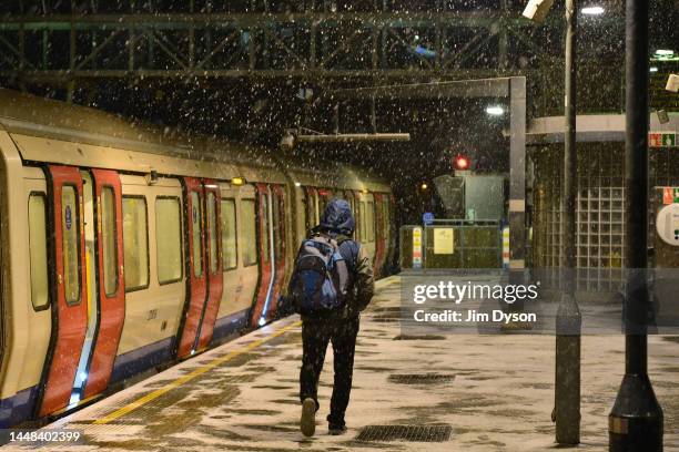 Snow falls at Wembley Park Station as snow, ice and freezing fog sweep across the country on December 11, 2022 in London, England. The UK Health...