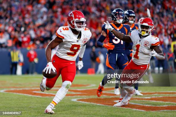 JuJu Smith-Schuster of the Kansas City Chiefs celebrates after catching a pass for a touchdown in the third quarter of a game against the Denver...