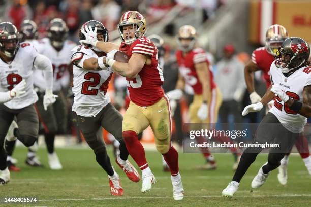 Christian McCaffrey of the San Francisco 49ers runs the ball for a touchdown during the third quarter of the game against the Tampa Bay Buccaneers at...